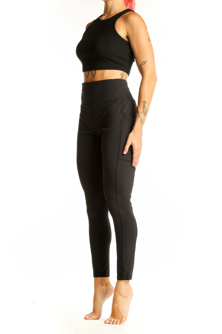 Front view of black high-waisted prAna performance leggings