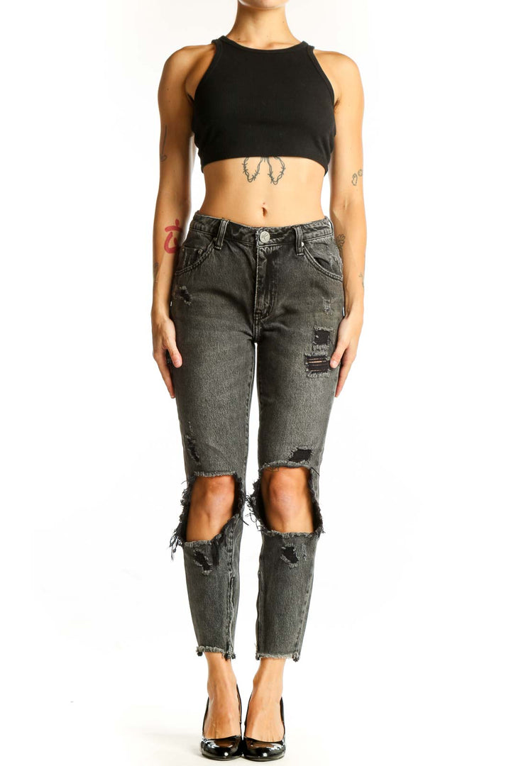 Front view of charcoal distressed high-waist jeans with knee cutouts