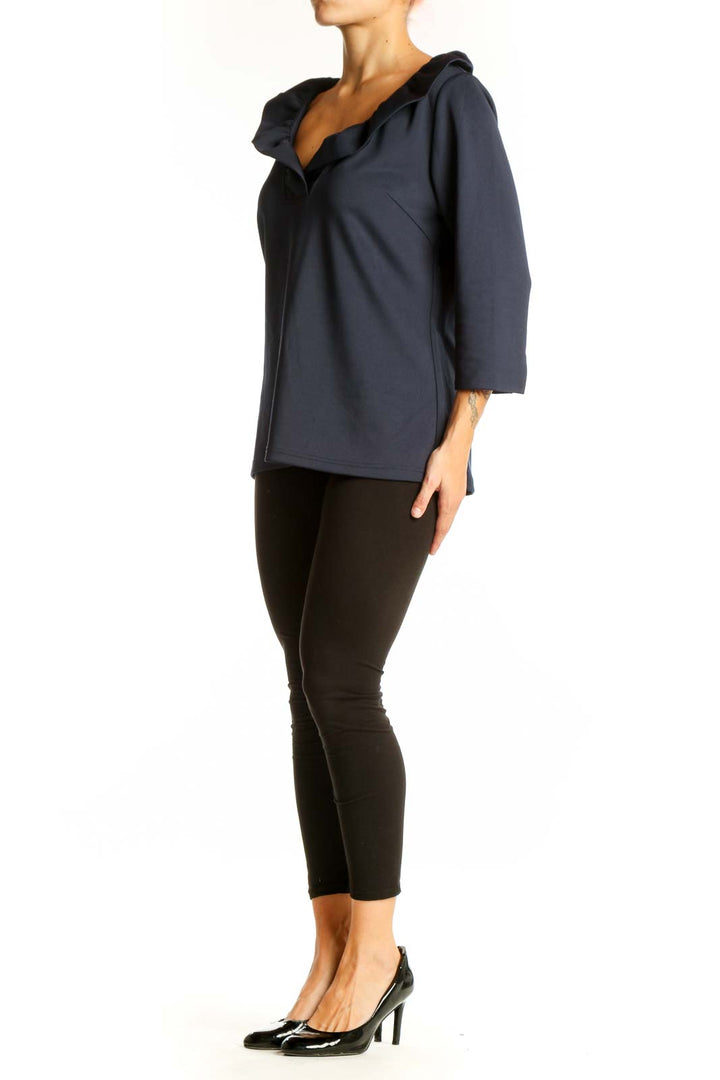 Front view of navy ruffled V-neck blouse by Gretchen Scott Designs