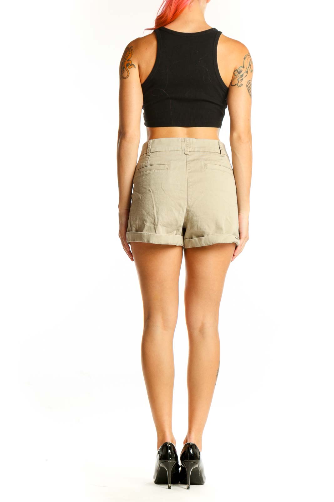 Side view of J.Crew khaki chino shorts on model with black crop top
