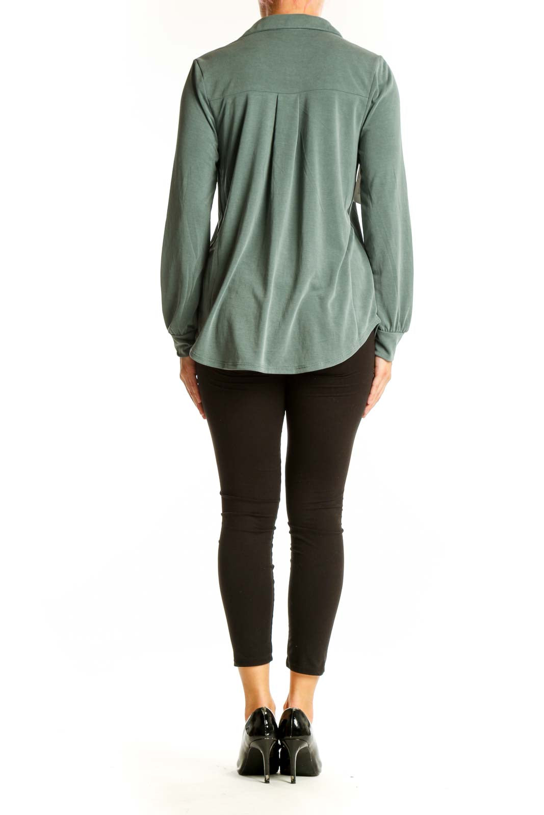 Side view of sage green long sleeve button-down blouse on model