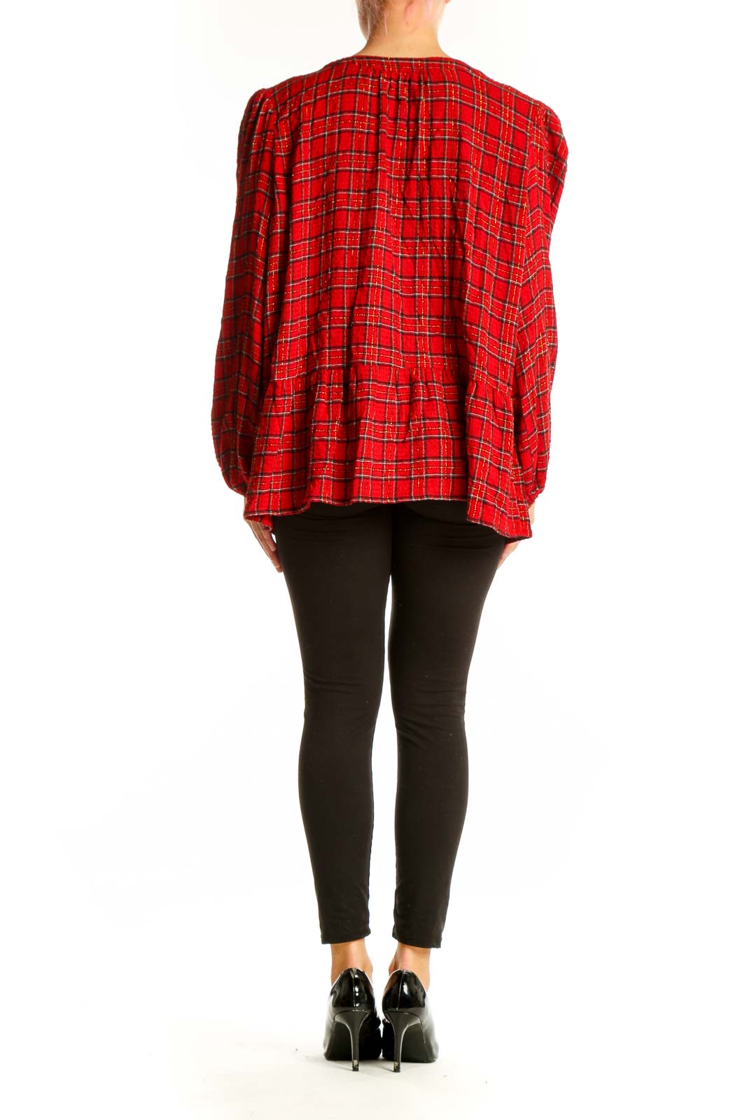 Side view of red plaid long sleeve peplum blouse from LOFT on model
