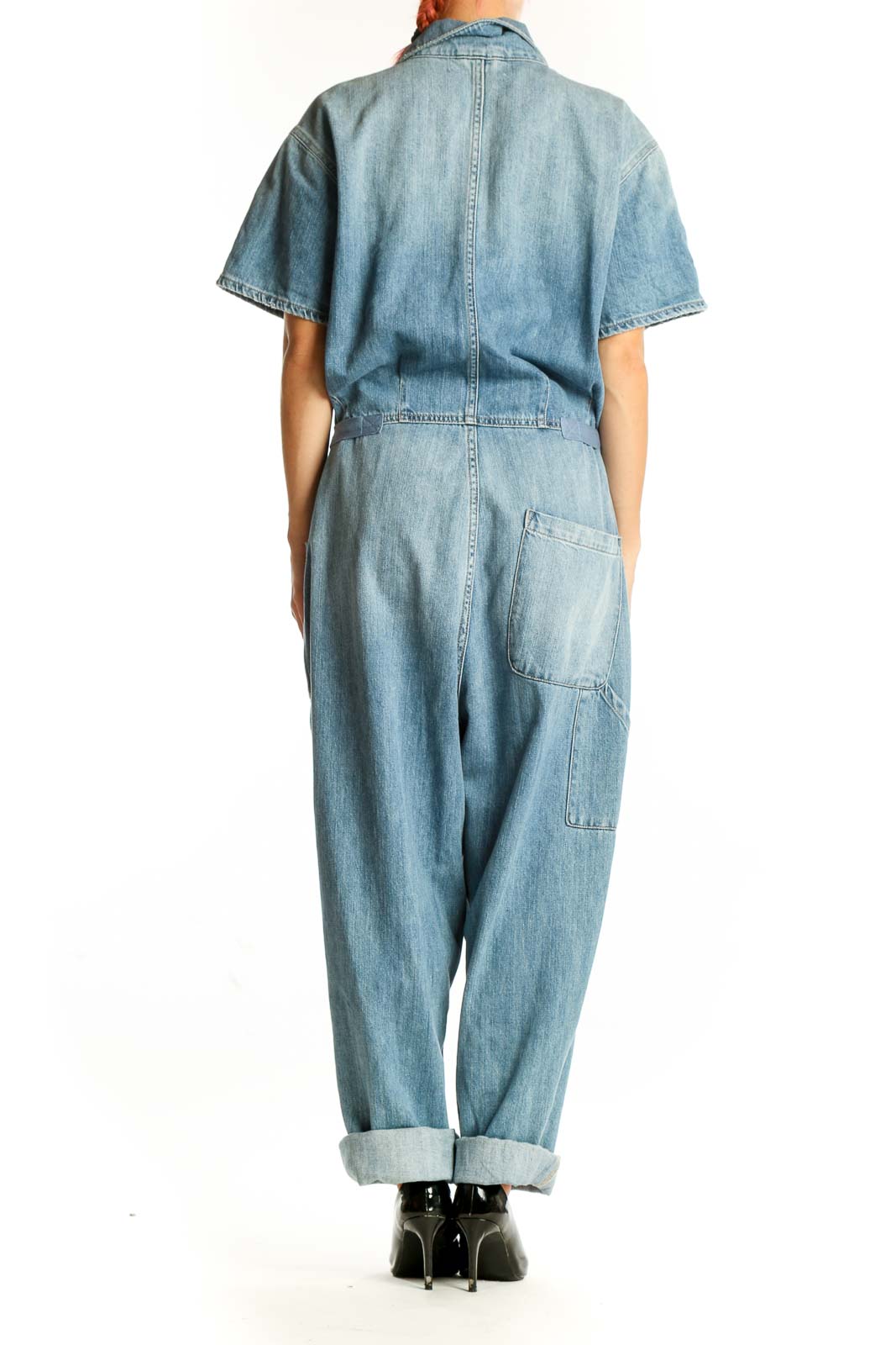 Back view of Pistola light blue denim short-sleeve jumpsuit with rolled cuffs