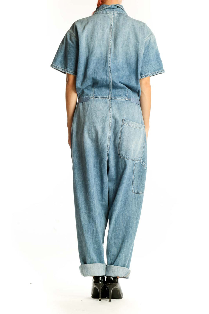 Back view of Pistola light blue denim short-sleeve jumpsuit with rolled cuffs