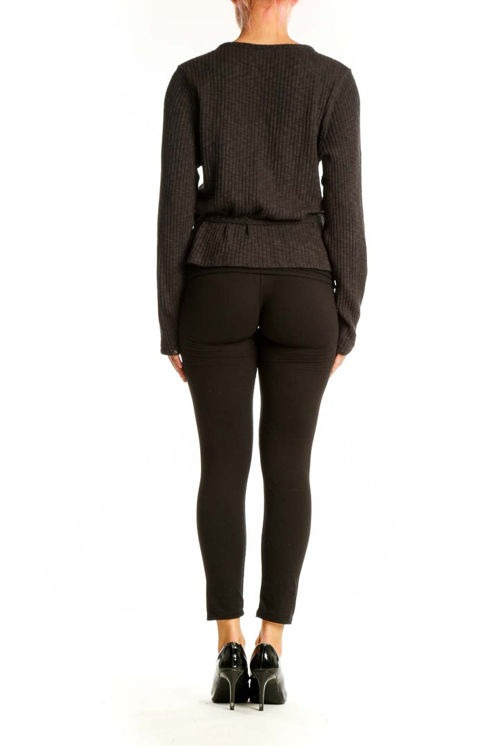 Side view of Everlane charcoal ribbed wrap sweater showing tie closure