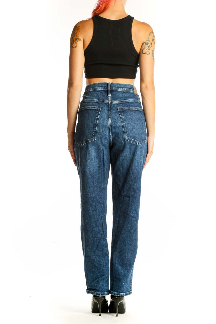 Back view of Madewell blue straight-leg jeans on model