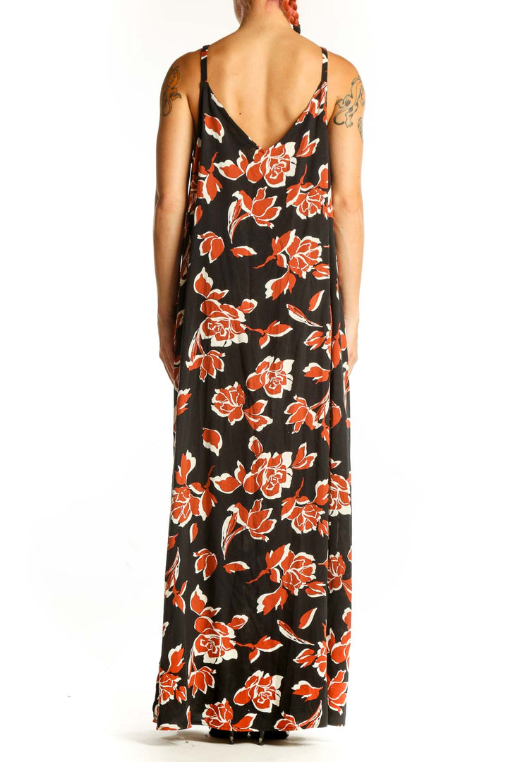 Side view of Vince Camuto black maxi dress with orange floral print