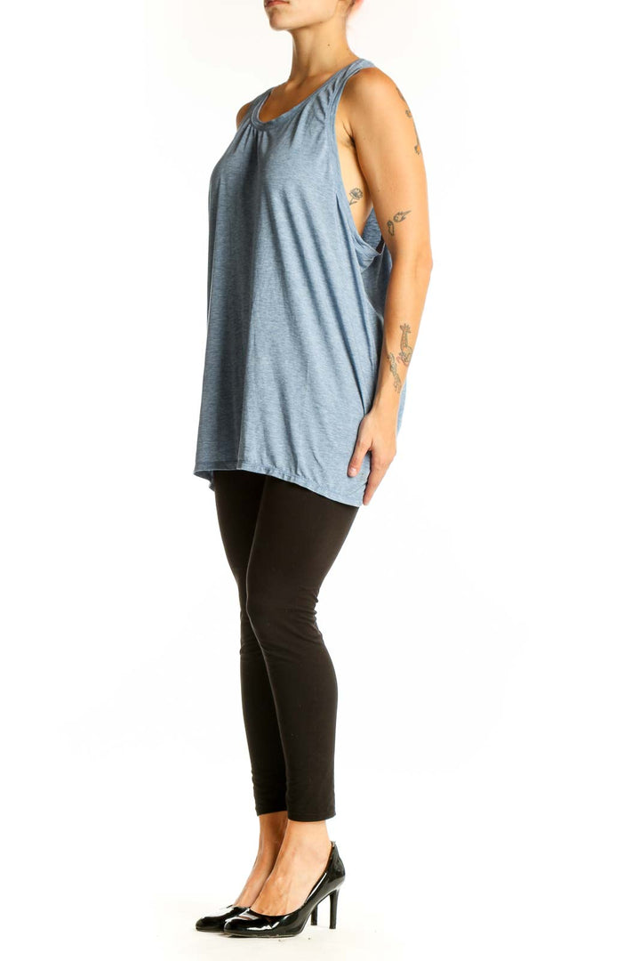 Front view of blue GapFit sleeveless tank top on model