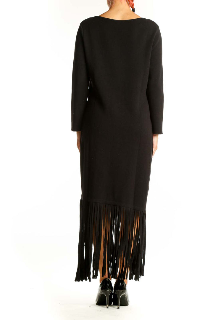 Side view of black Anne Klein maxi dress showing fringe hem