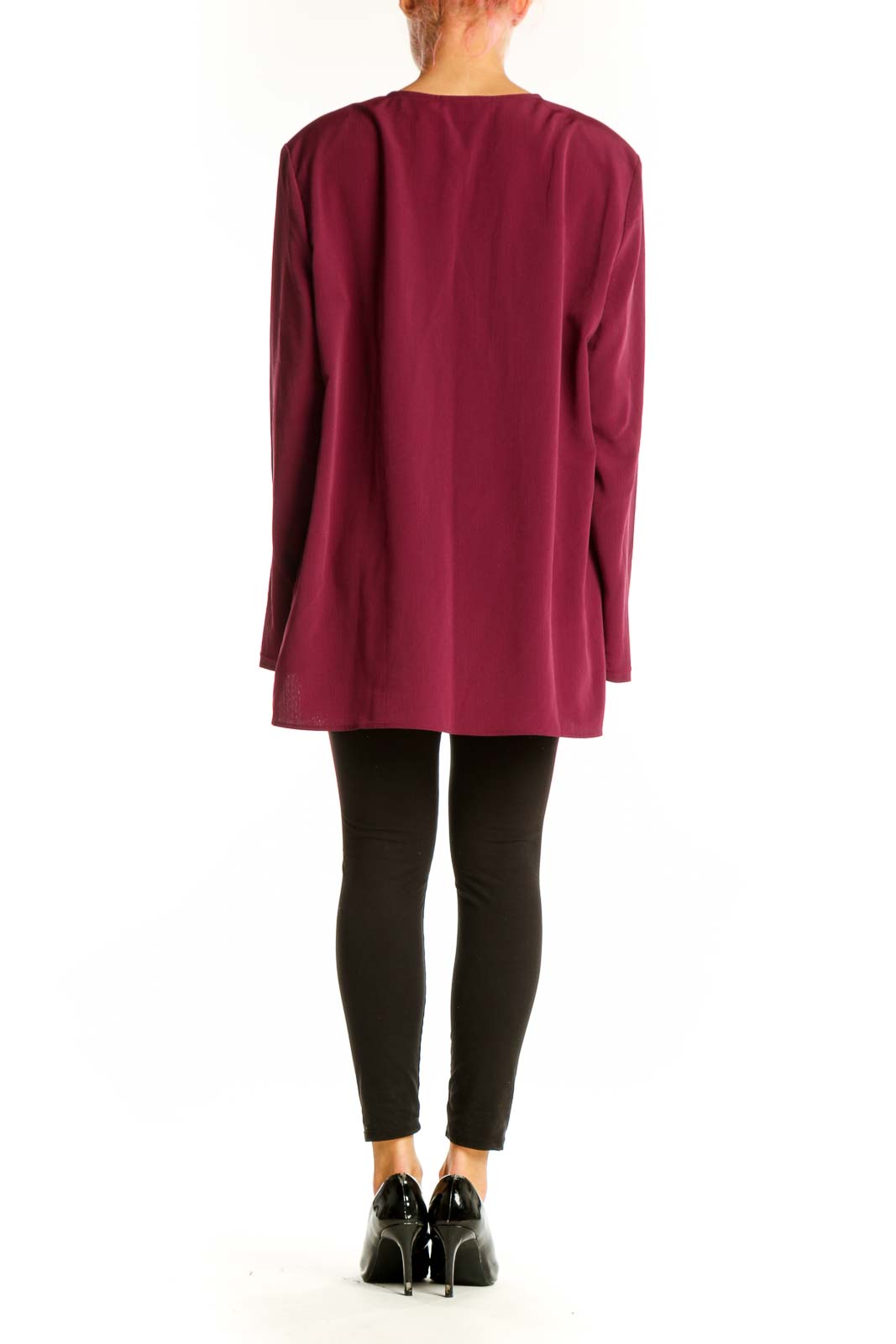Side view of model wearing burgundy Maggie Sweet tunic top with black pants
