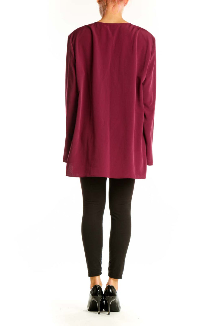 Side view of model wearing burgundy Maggie Sweet tunic top with black pants