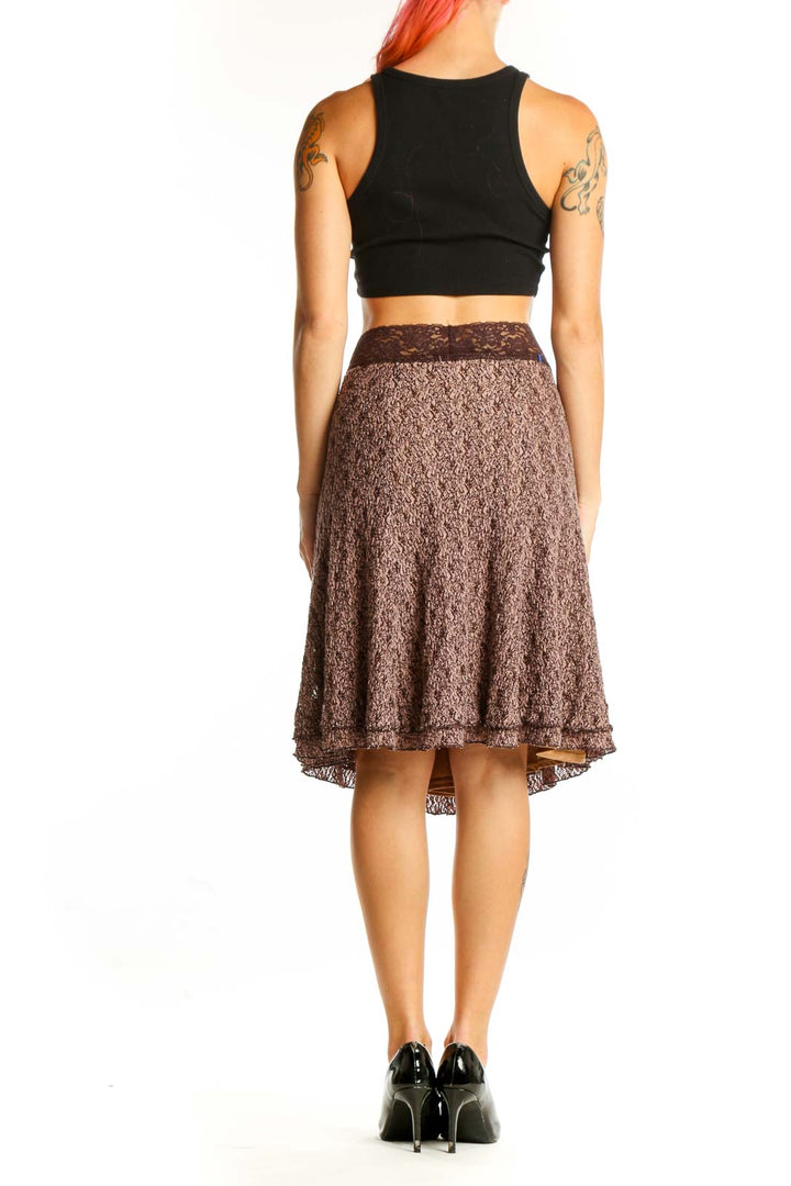 Side view of brown textured A-line skirt on model with black top