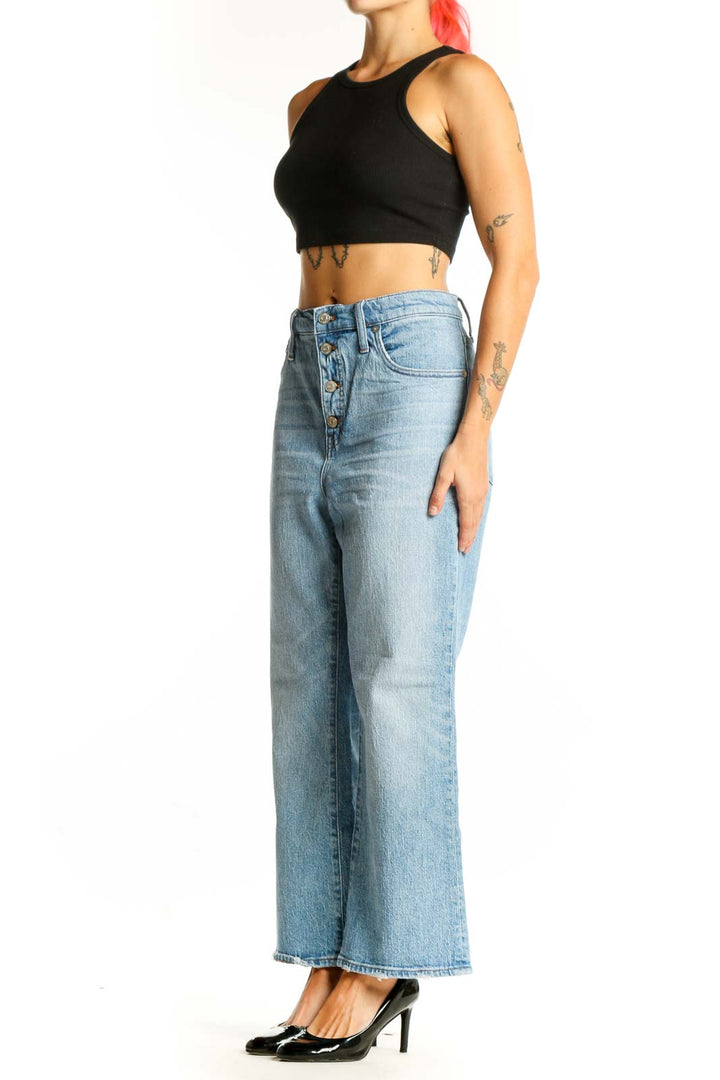 Front view of Madewell light blue wide-leg jeans with button-fly closure