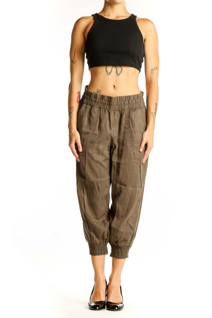 Front view of olive Athleta Lyocell cropped jogger pants