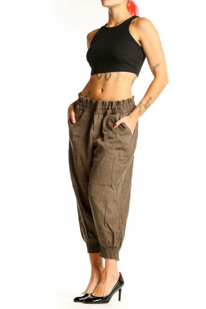 Front view of olive Athleta Lyocell cropped jogger pants