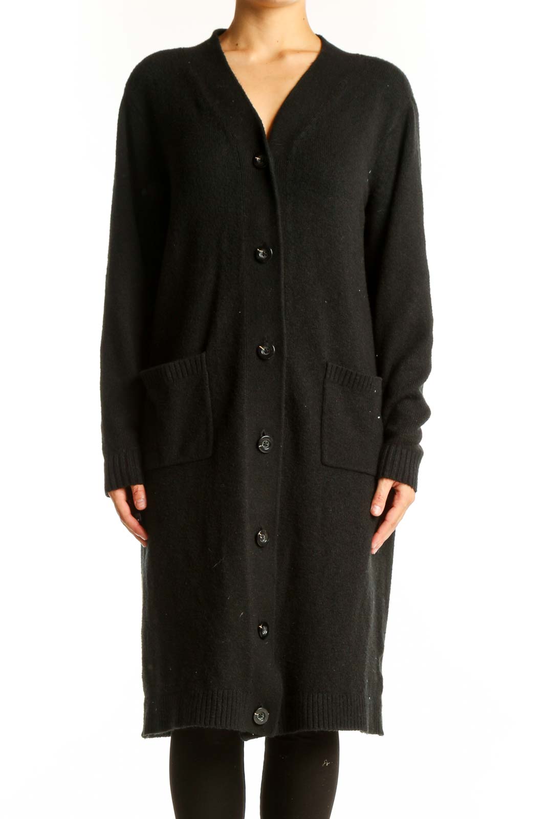 Front view of Cabi black long button-up cardigan on model