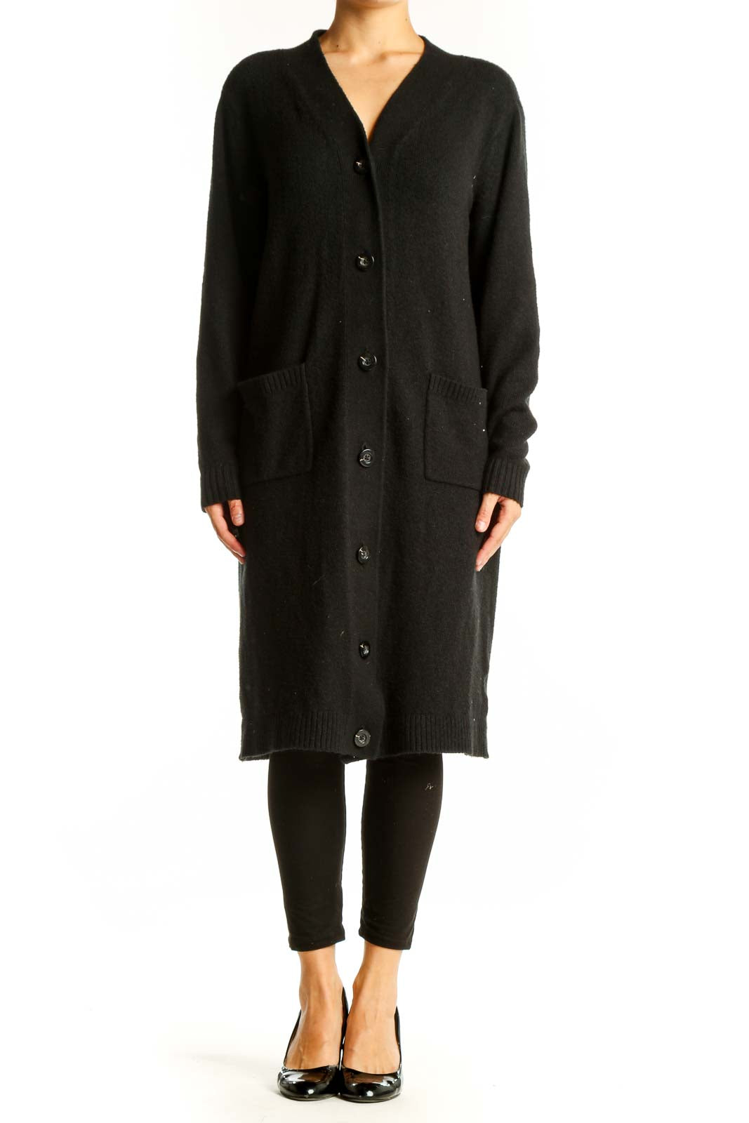 Front view of Cabi black long button-up cardigan on model