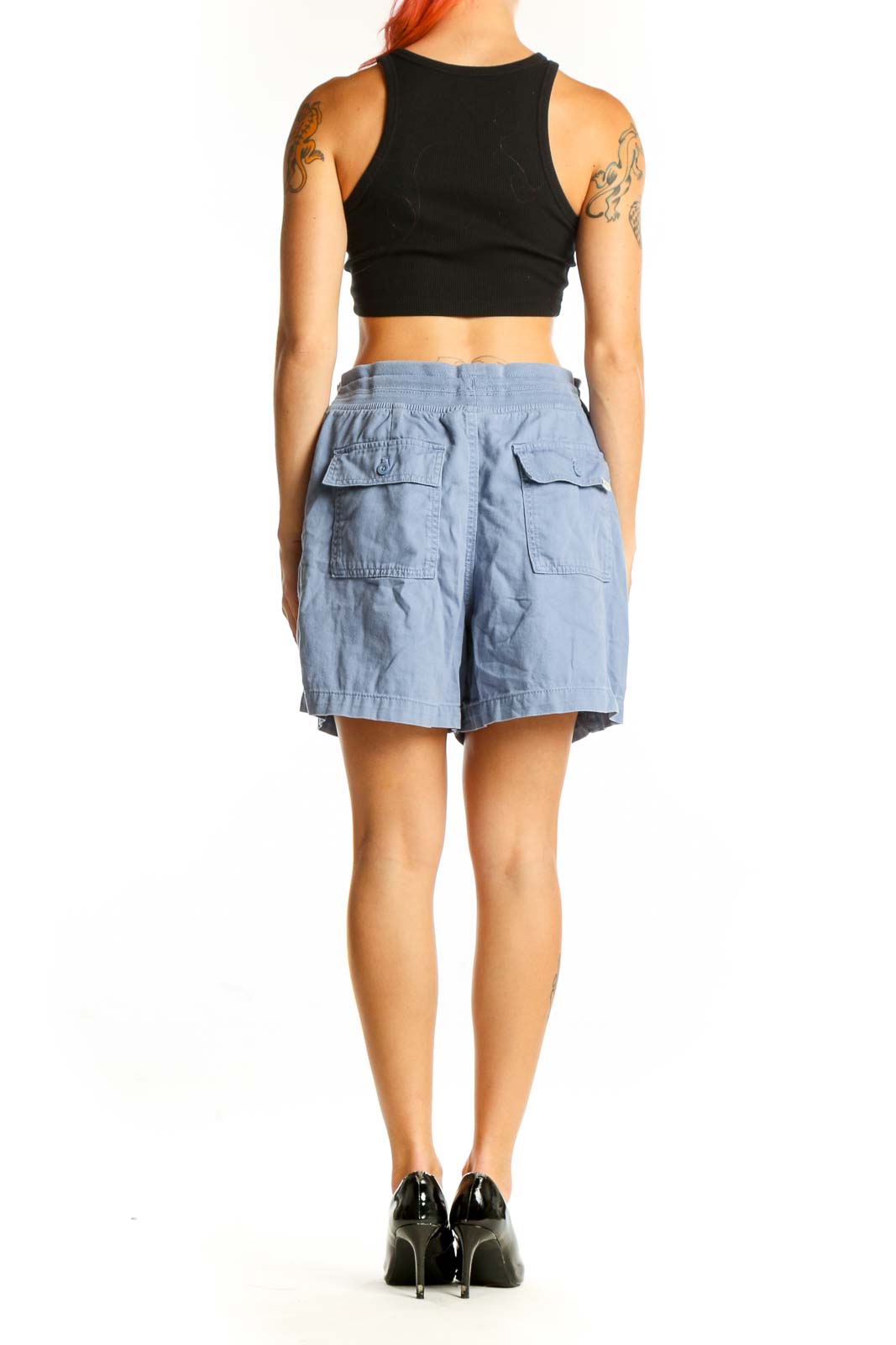 Side view of light blue Orvis casual shorts on model with black top