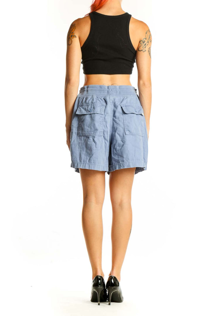 Side view of light blue Orvis casual shorts on model with black top