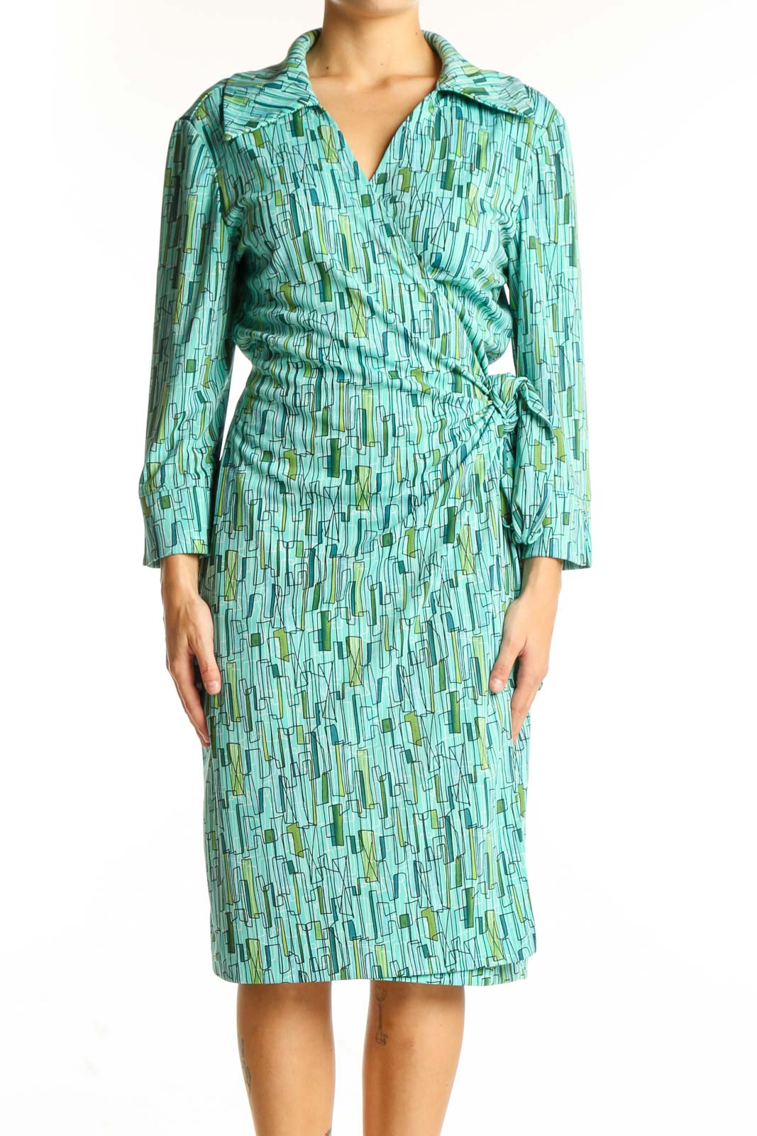 Front view of DANI-MAX teal geometric print wrap dress with long sleeves