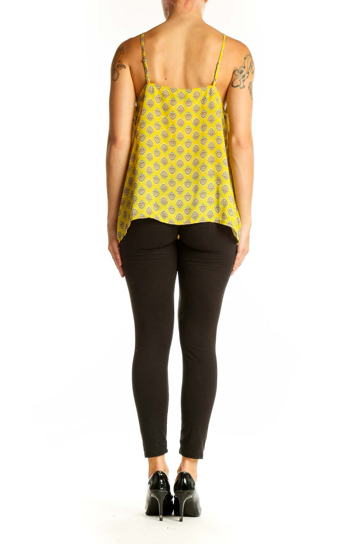 Side view of yellow patterned camisole top from Banana Republic on model