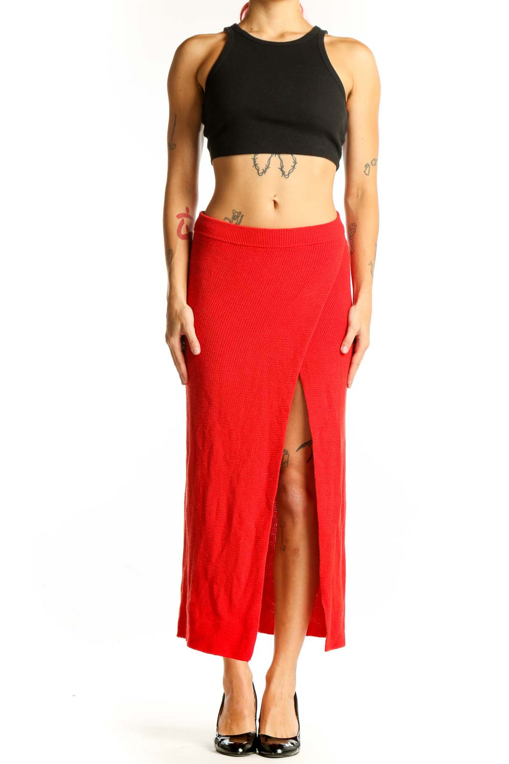 Front view of red ribbed knit maxi skirt with side slit