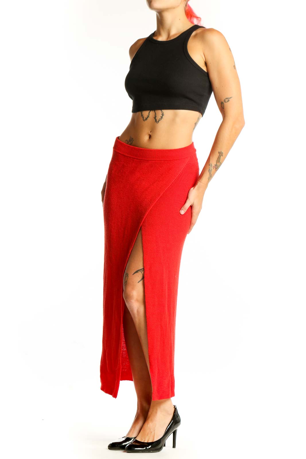 Front view of red ribbed knit maxi skirt with side slit