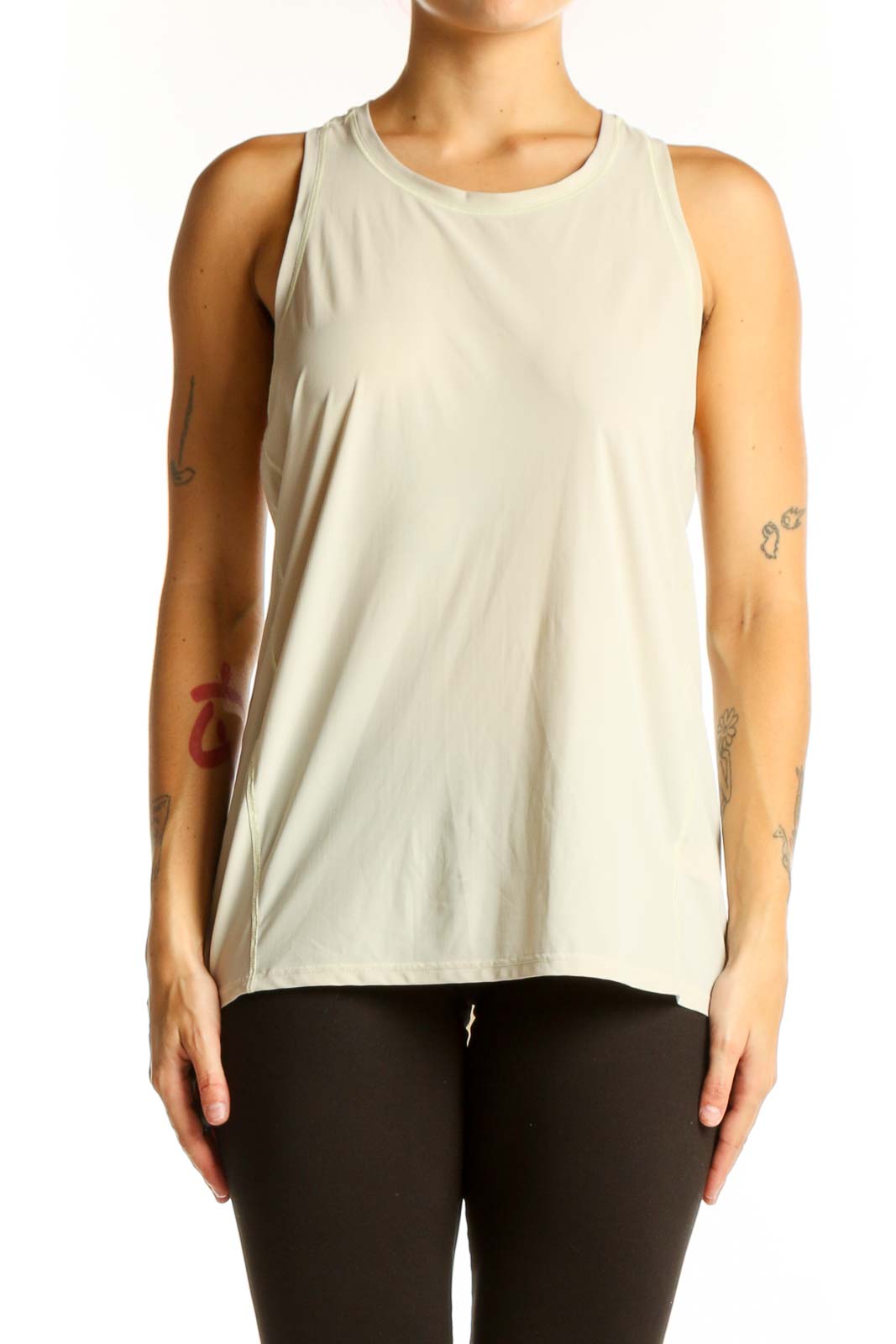 Front view of beige Athleta sleeveless athletic tank top