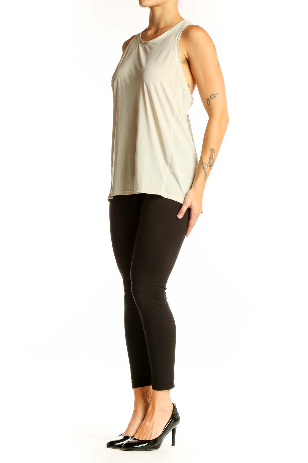 Front view of beige Athleta sleeveless athletic tank top