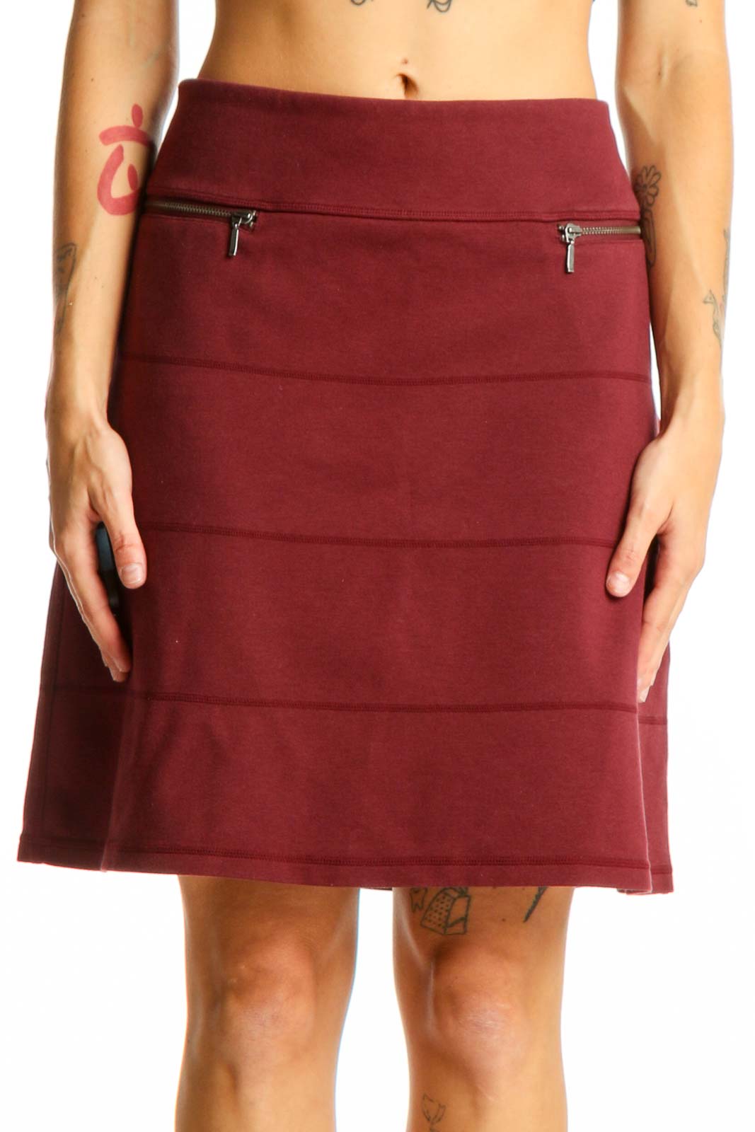 Front view of burgundy A-line skirt with zip pockets
