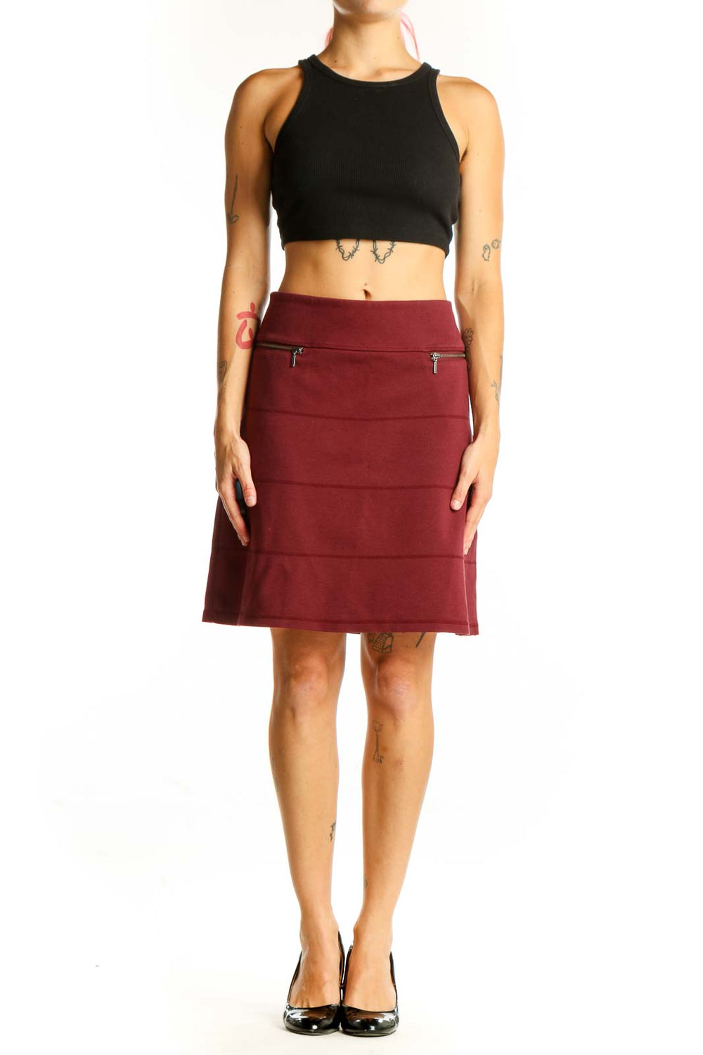 Front view of burgundy A-line skirt with zip pockets