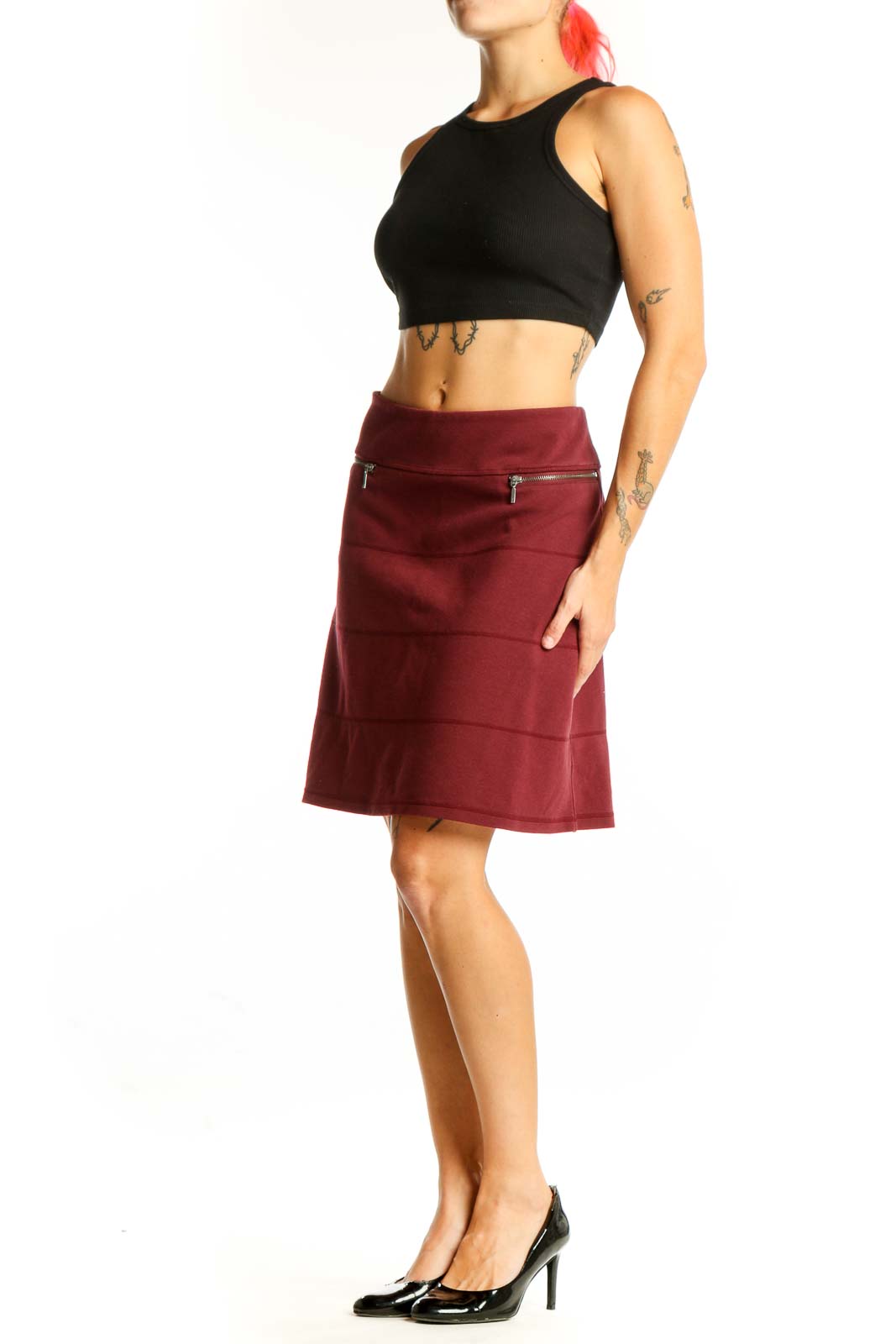 Front view of burgundy A-line skirt with zip pockets