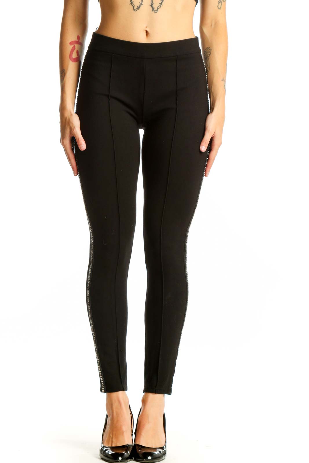 Front view of black fitted pants with metallic side stripes by Romeo & Juliet Couture