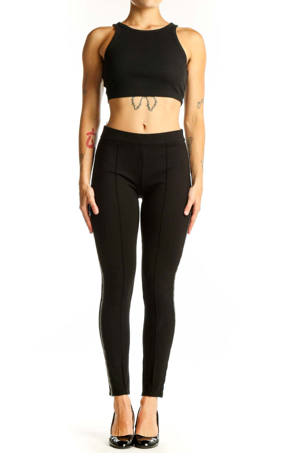 Front view of black fitted pants with metallic side stripes by Romeo & Juliet Couture