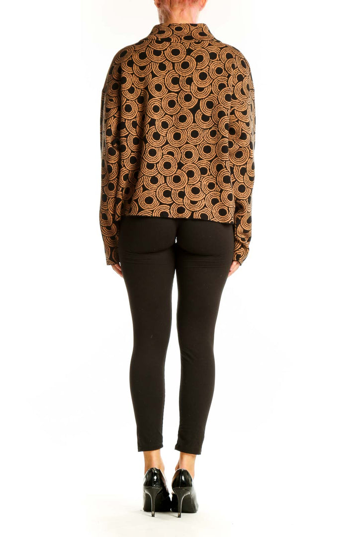 Side view of brown circular pattern mock neck sweater by Maeve on model
