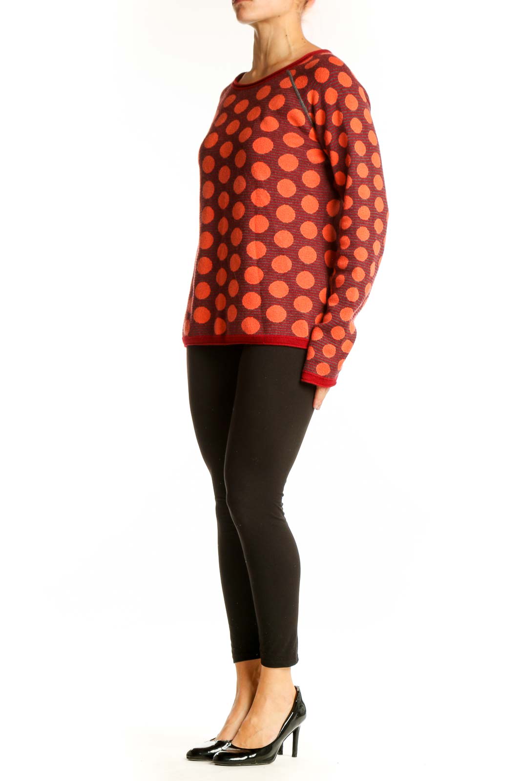 Front view of Title Nine red sweater with orange polka dots