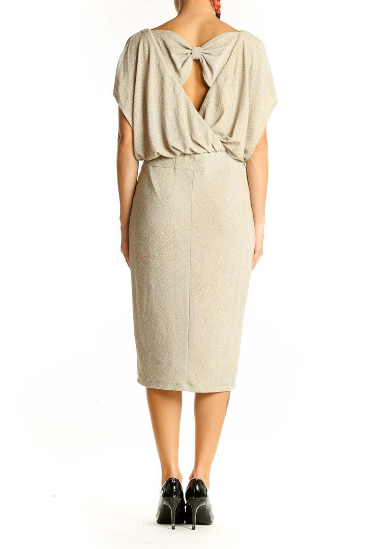Side view of Sangria beige metallic blouson midi dress showing fitted skirt