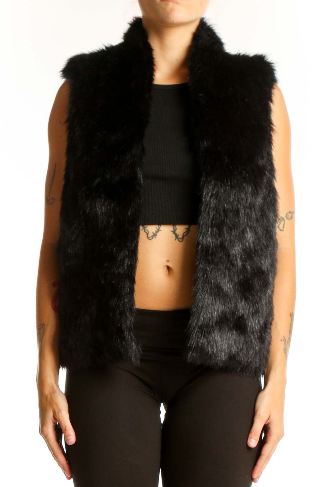 Front view of black faux fur sleeveless vest from Express