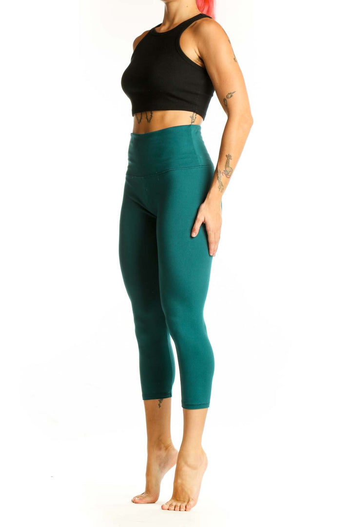 Front view of teal high-waisted capri leggings from Zobha