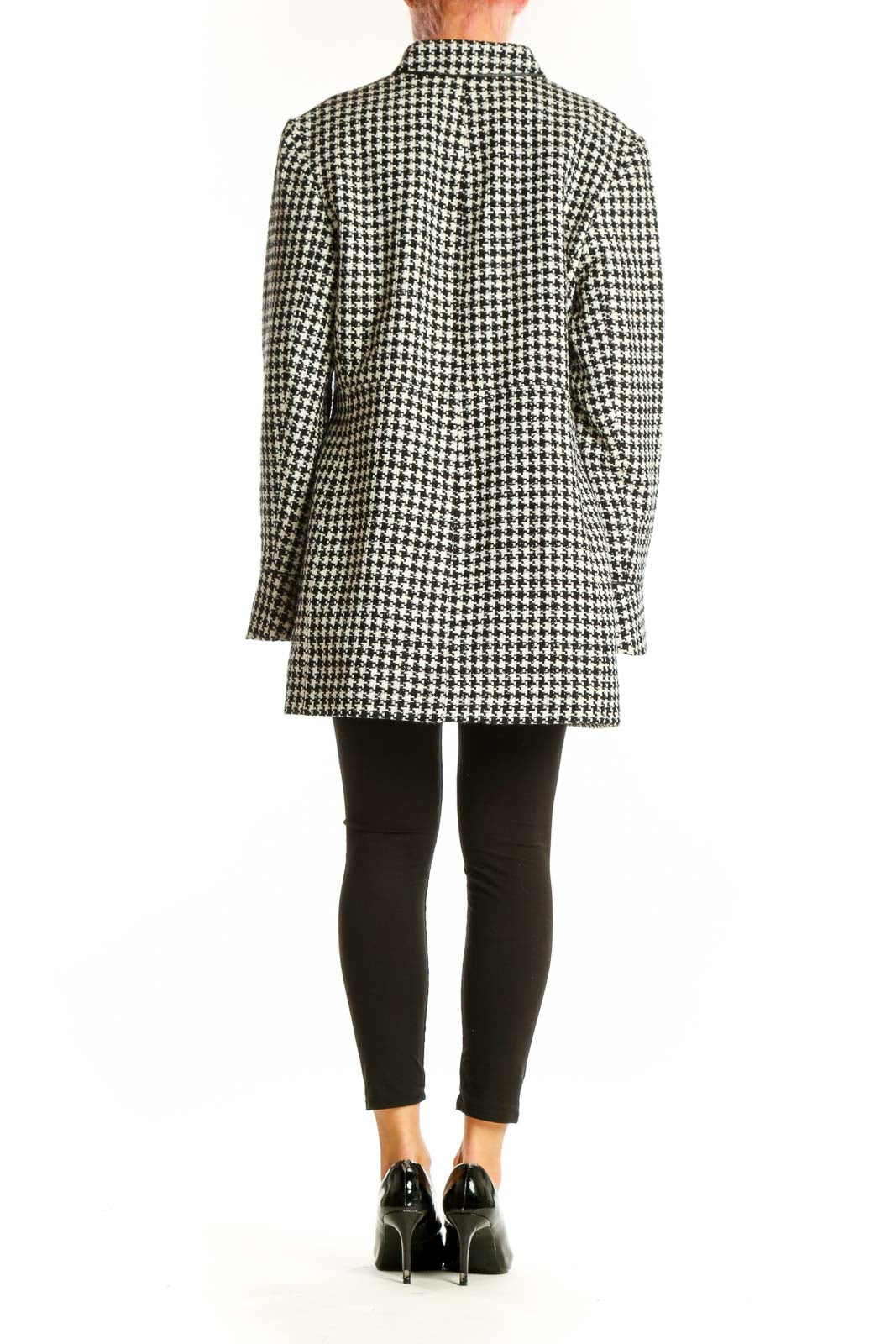 Side view of The Limited black and white houndstooth oversized jacket on model