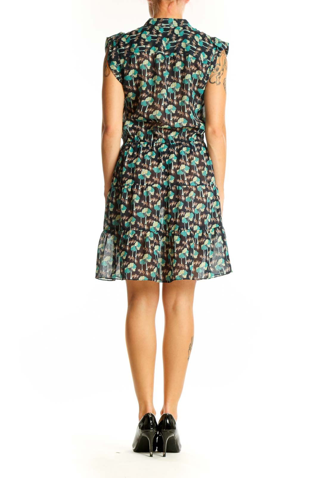 Side view of Gap green floral print sleeveless dress showing gathered waist and flowy silhouette