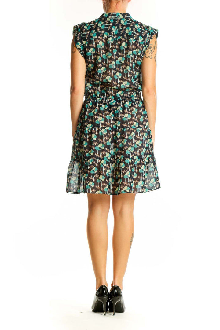 Side view of Gap green floral print sleeveless dress showing gathered waist and flowy silhouette