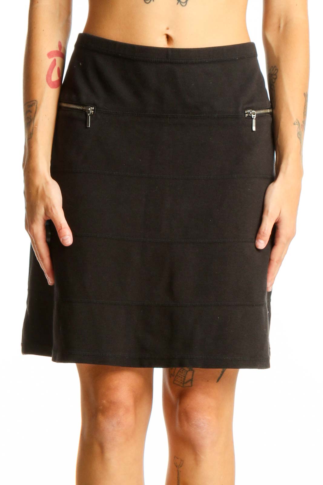 Front view of black Athleta A-line skirt with zip pockets