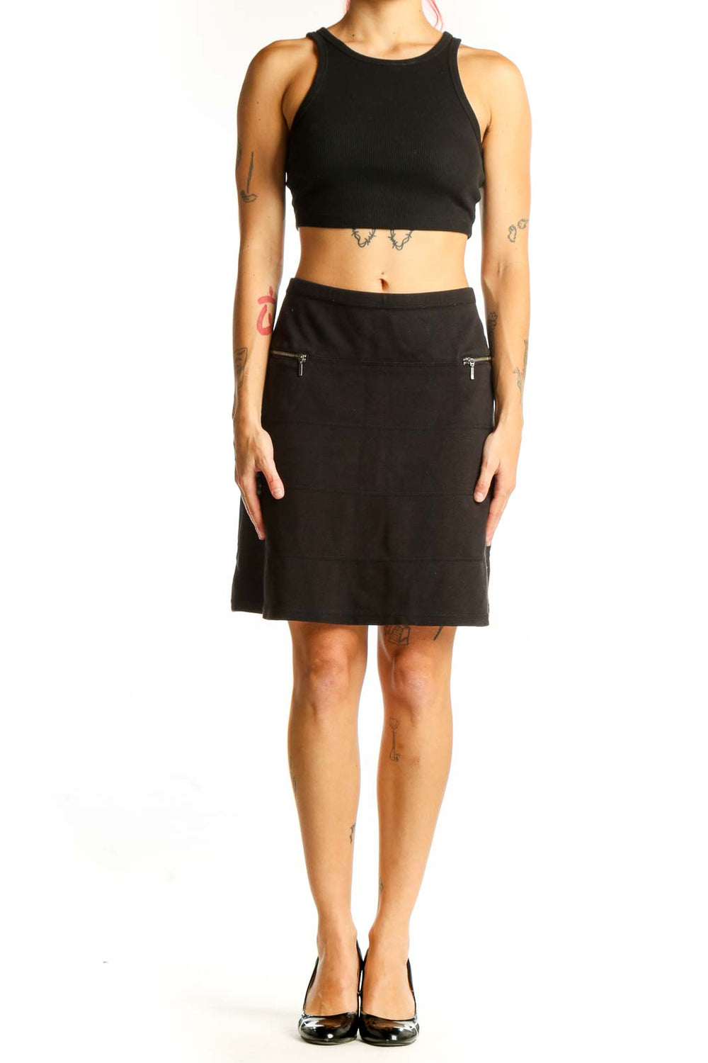 Front view of black Athleta A-line skirt with zip pockets