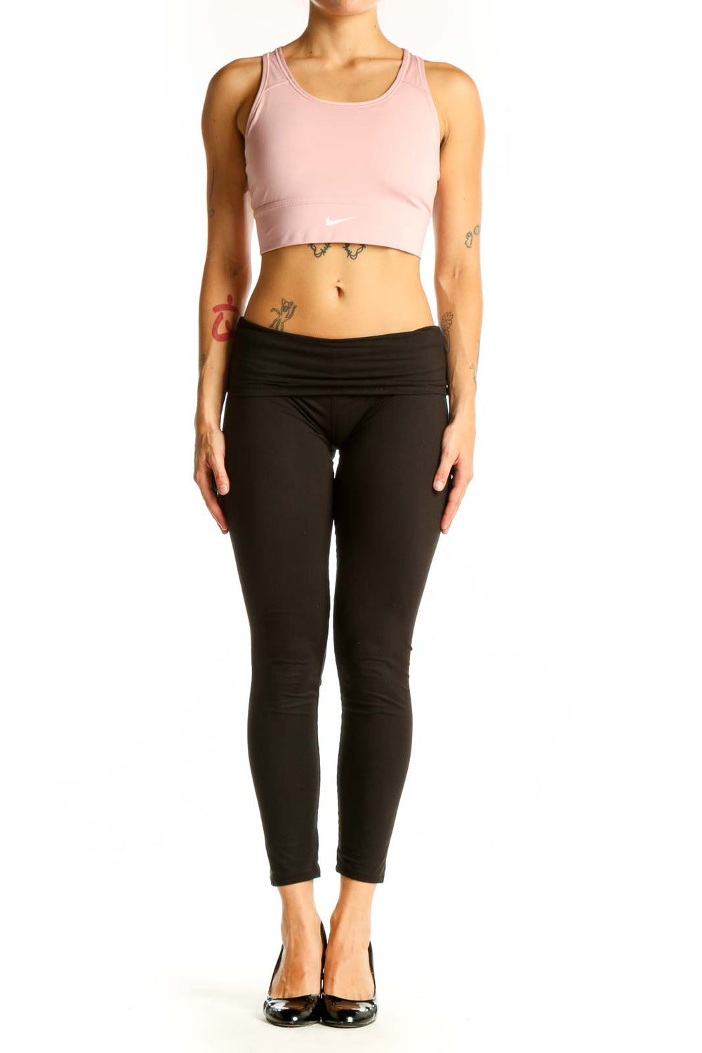 Front view of pink Nike cropped athletic tank top