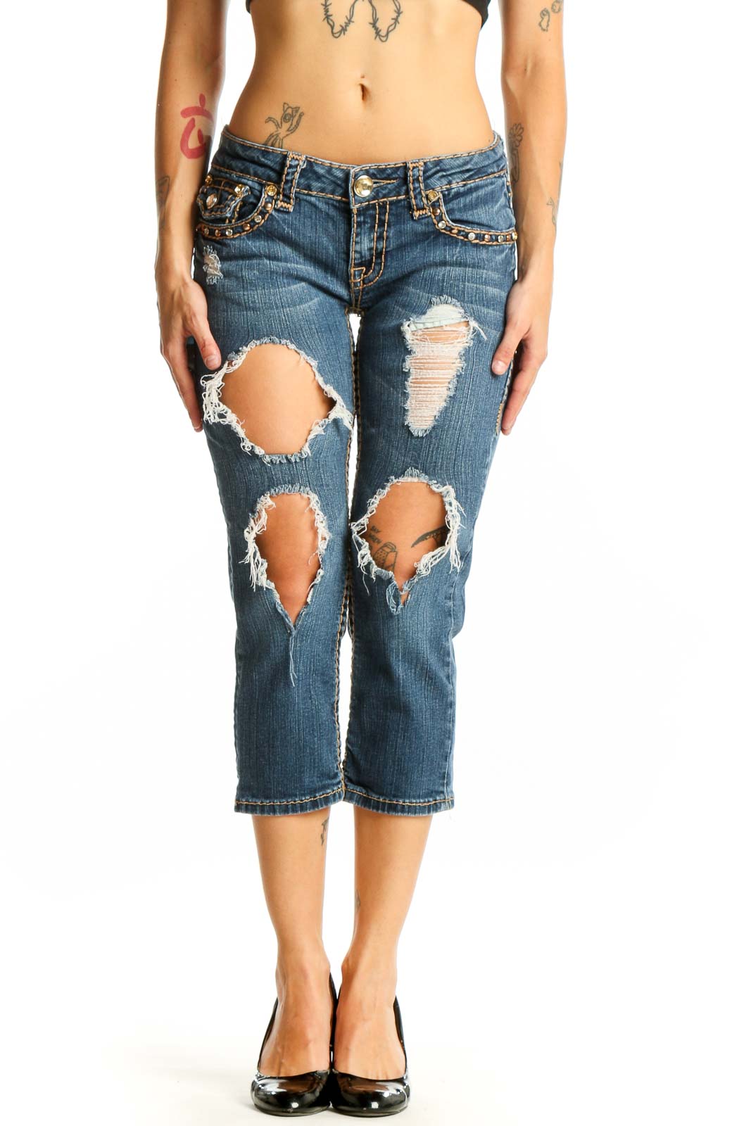 Front view of LA IDOL blue distressed capri jeans with rips and embellishments