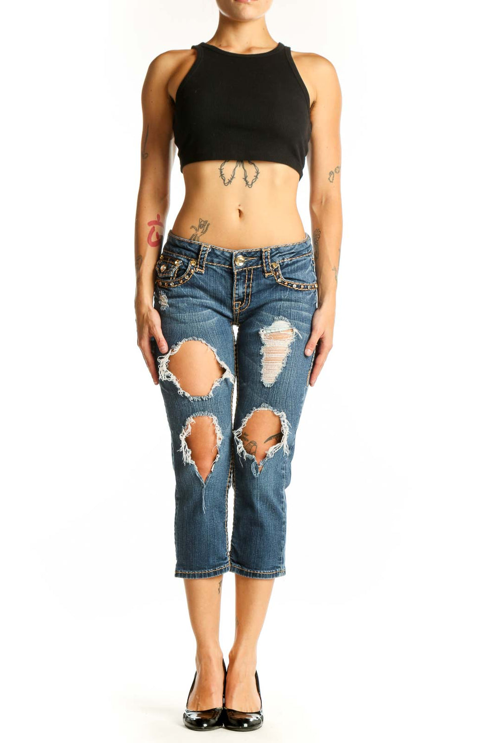 Front view of LA IDOL blue distressed capri jeans with rips and embellishments