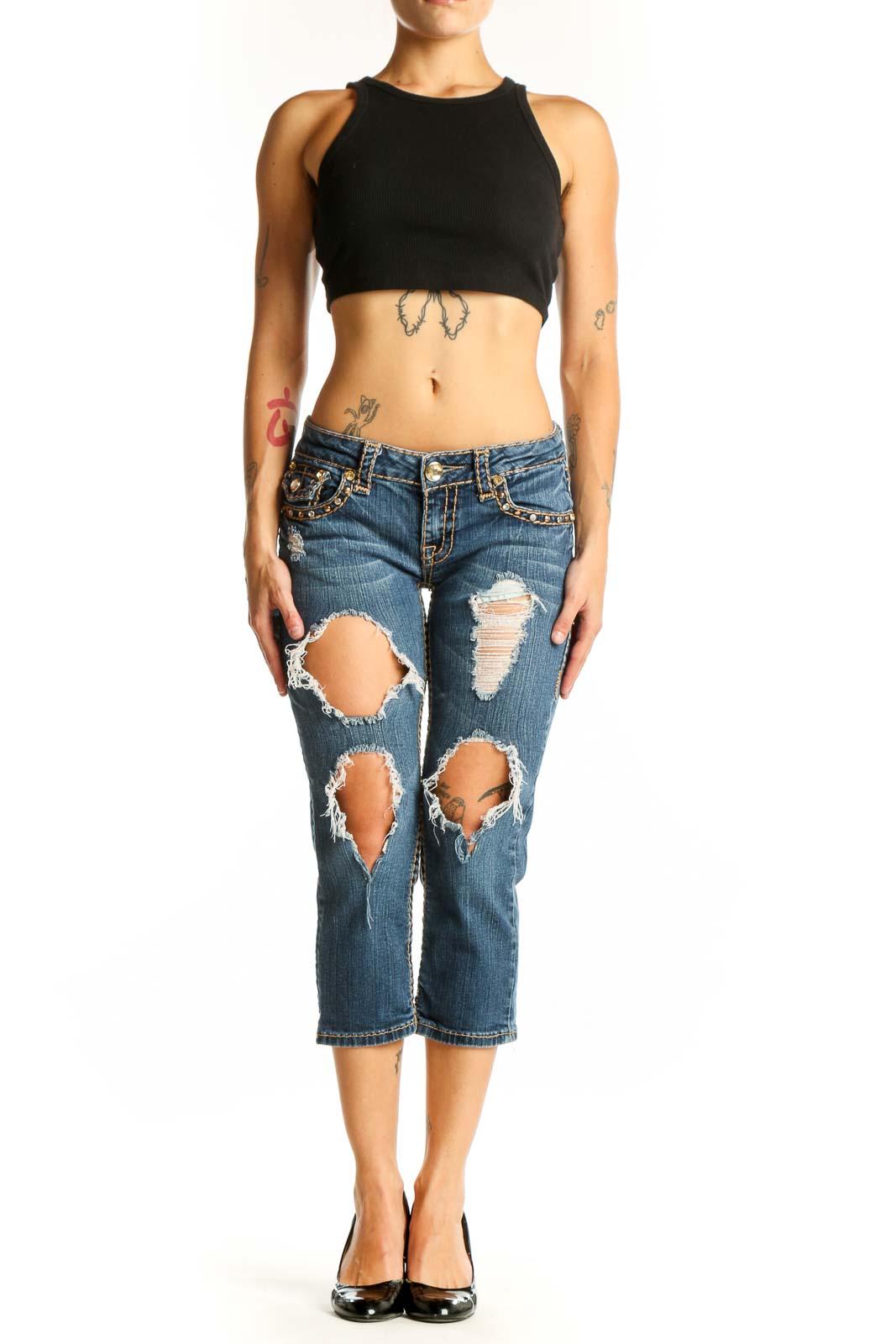 Front view of LA IDOL blue distressed capri jeans with rips and embellishments