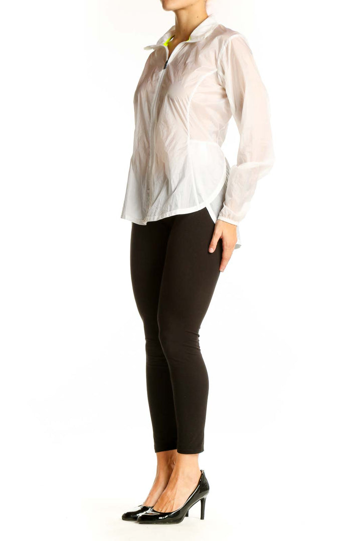 Front view of white Brooks activewear jacket with zip closure