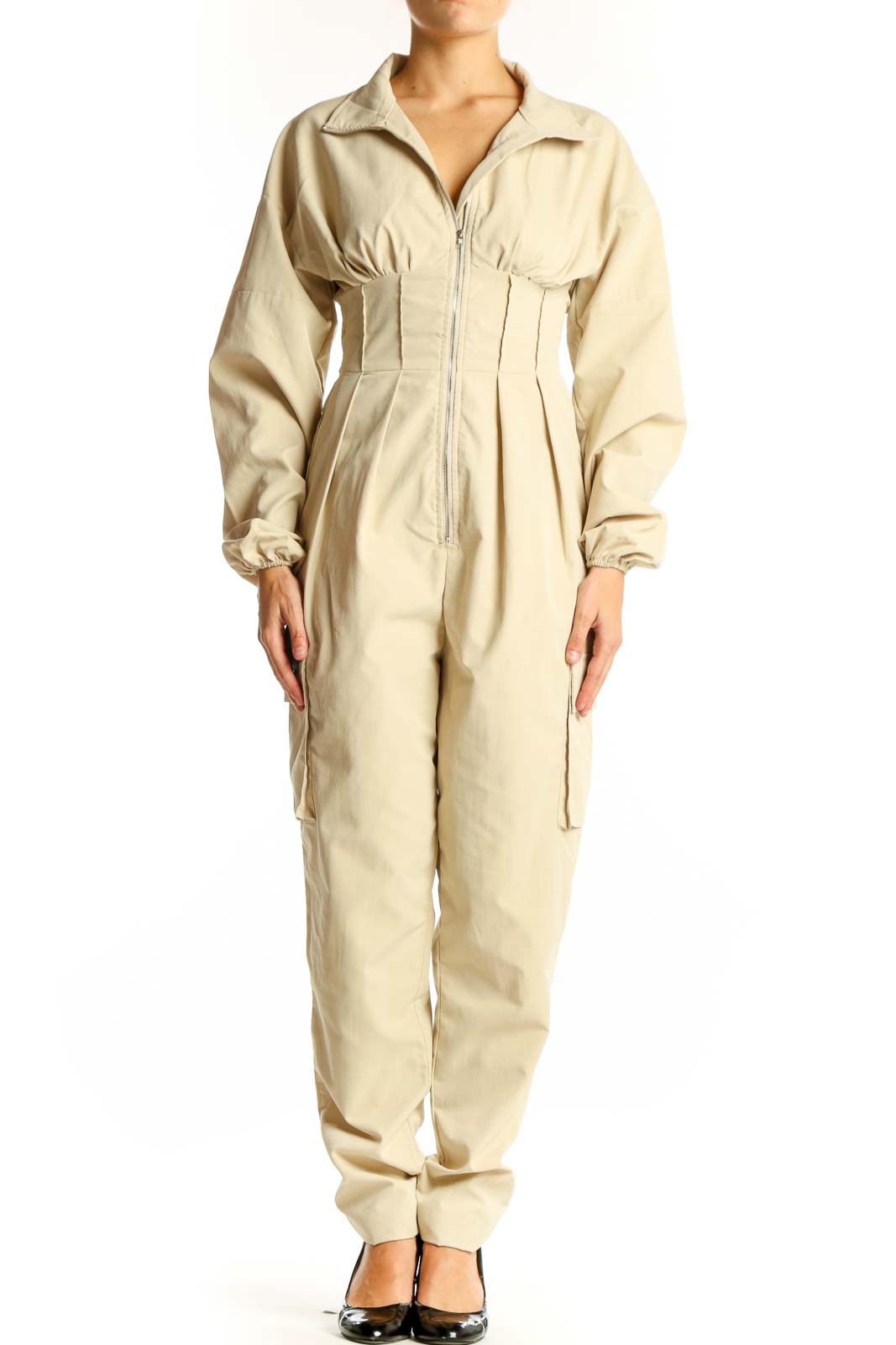 Front view of beige utility jumpsuit with zip-up front and cinched waist